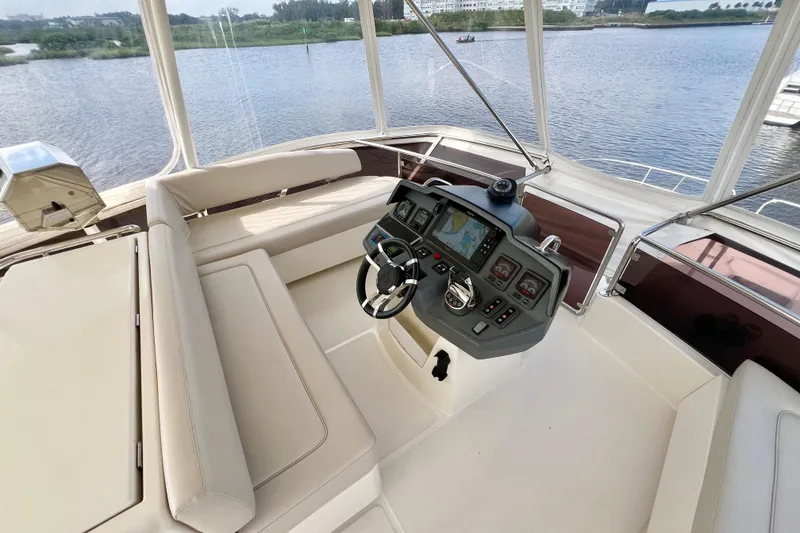 Slide: The Image of Luxurious 2019 Aquila 44 yacht helm with modern navigation system and comfortable seating. - 28