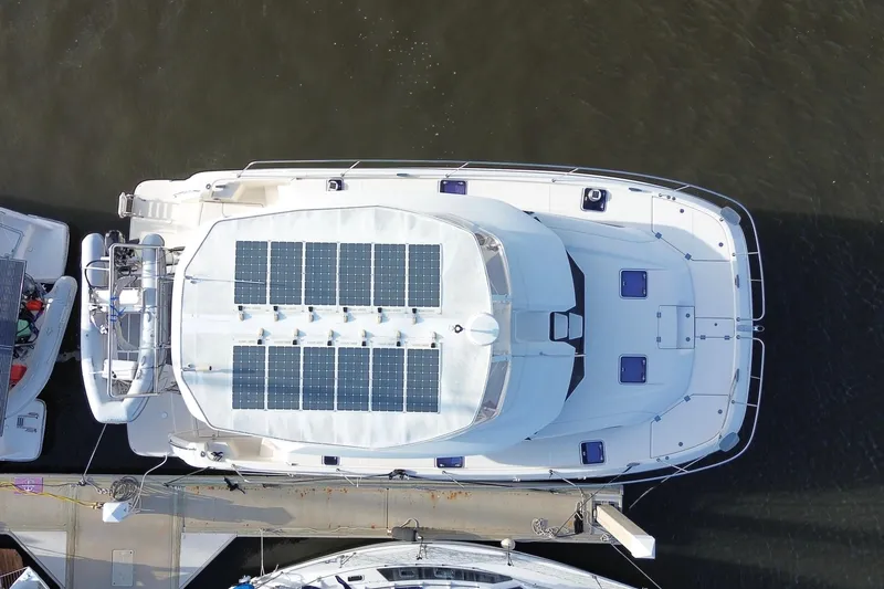 Slide: The Image of Aerial view of 2019 Aquila 44 yacht with solar panels docked at marina. - 3