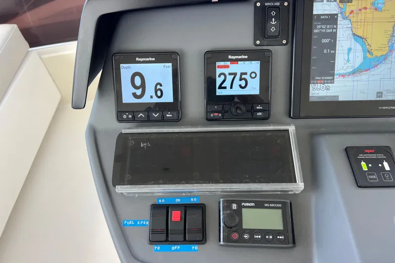 Slide: The Image of Aquila 44 yacht dashboard with navigation instruments and depth display, 2019 model. - 31