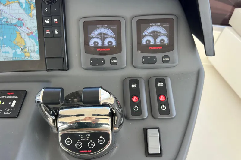 Slide: The Image of Control panel of a 2019 Aquila 44 yacht with navigation and engine displays. - 32