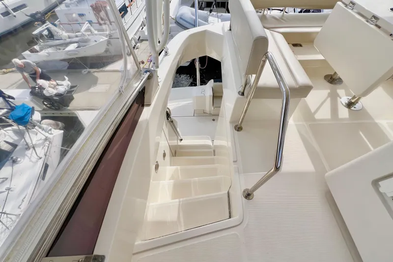 Slide: The Image of 2019 Aquila 44 yacht interior with stairs and seating area. - 35