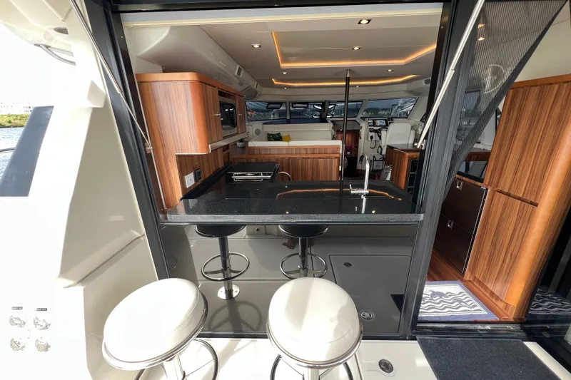Slide: The Image of Luxurious 2019 Aquila 44 yacht interior with modern kitchen and seating area. - 39