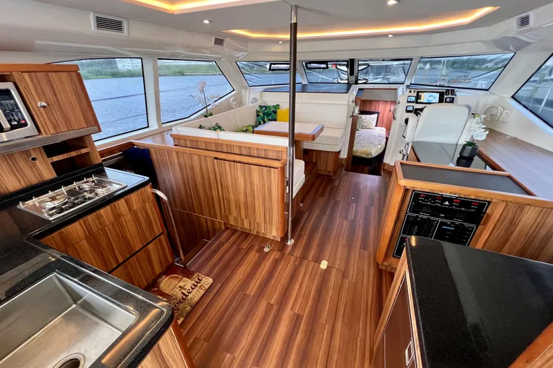 Slide: The Image of Luxurious interior of 2019 Aquila 44 yacht with modern kitchen and seating area. - 40