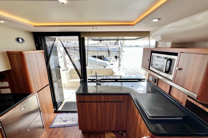 Slide: The Image of Luxurious interior of 2019 Aquila 44 yacht with modern kitchen and waterfront view. - 41
