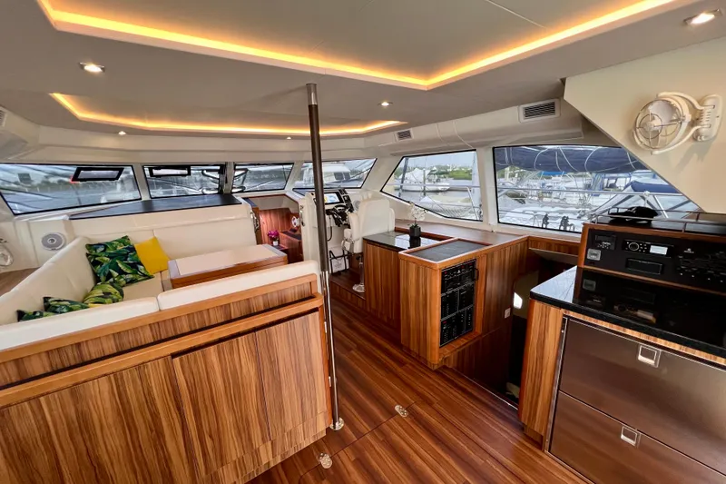 Slide: The Image of Luxurious interior of 2019 Aquila 44 yacht with modern wood finishes and plush seating. - 42