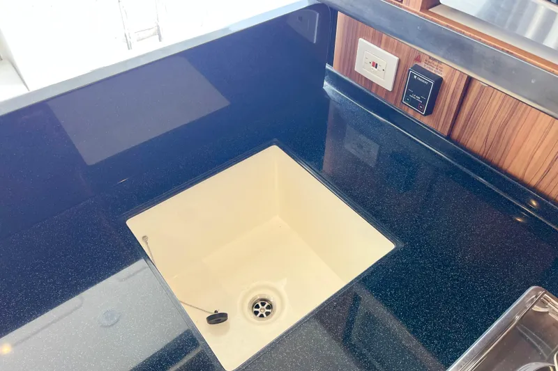 Slide: The Image of Modern kitchen sink on Aquila 44 yacht, 2019 model, with sleek countertop design. - 47