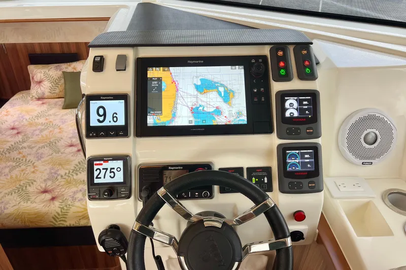 Slide: The Image of Helm of 2019 Aquila 44 yacht with navigation screens and controls. - 57