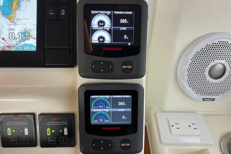 Slide: The Image of Control panel of a 2019 Aquila 44 with Yanmar displays and navigation system. - 58