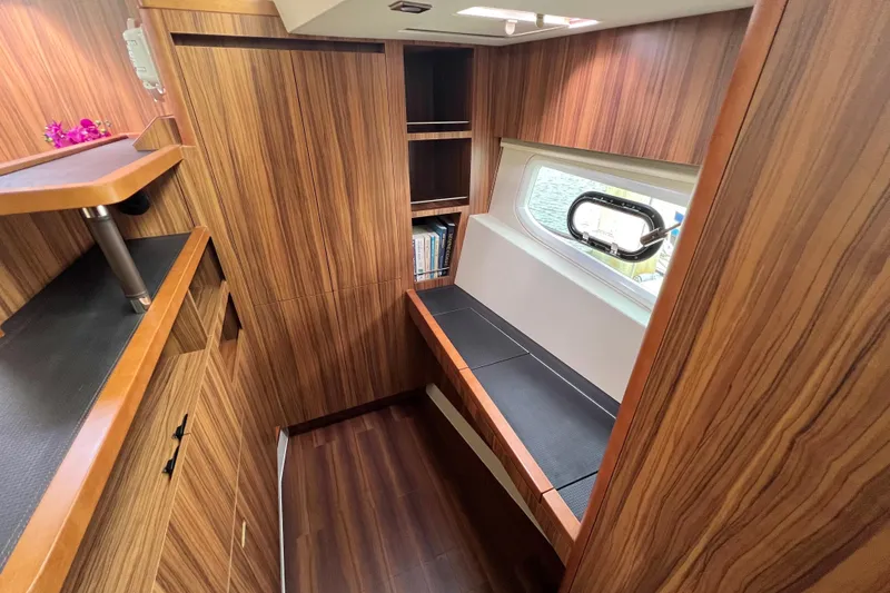 Slide: The Image of Interior of 2019 Aquila 44 yacht with wooden finish and floral bedding. - 73