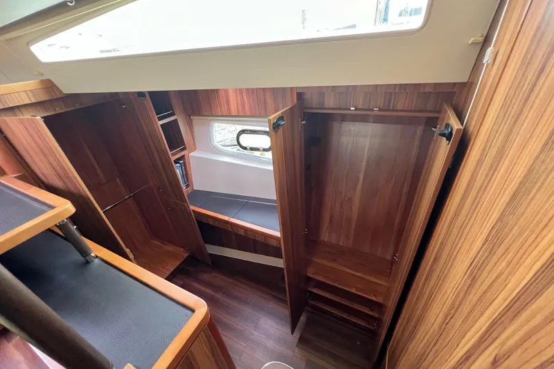 Slide: The Image of Luxurious wood interior of 2019 Aquila 44 yacht with seating and window view. - 74