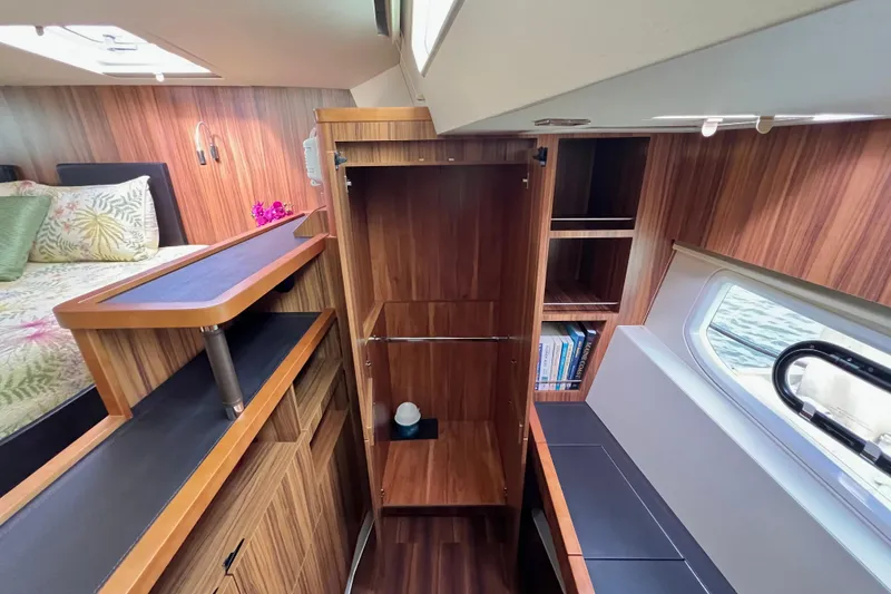 Slide: The Image of Interior of 2019 Aquila 44 yacht with wooden cabinetry and seating area. - 75