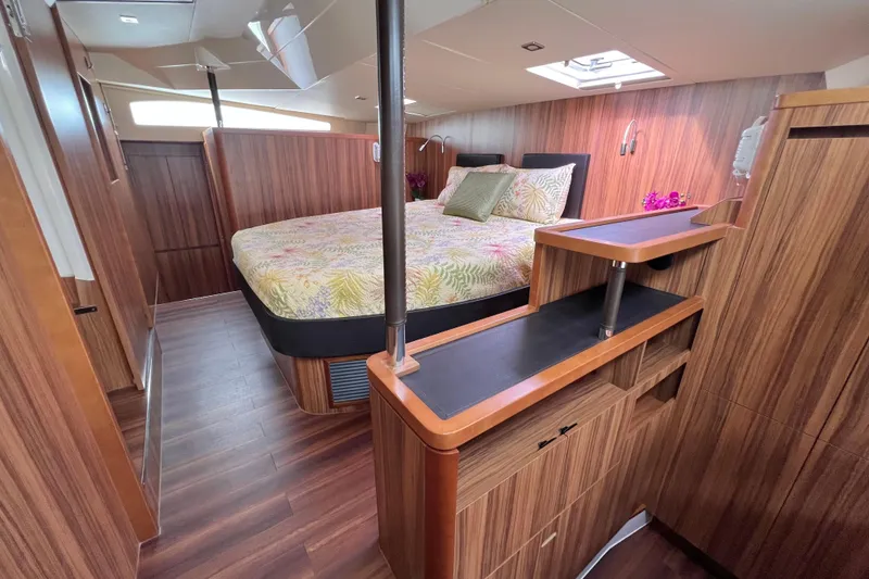 Slide: The Image of Luxurious interior of 2019 Aquila 44 yacht with wood finish and cozy bedroom. - 76