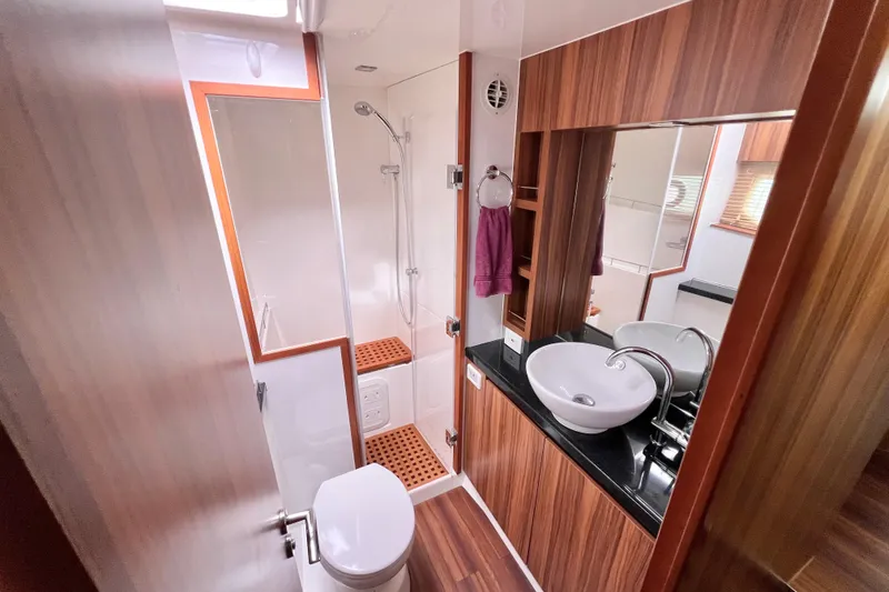 Slide: The Image of Interior of 2019 Aquila 44 yacht with sleek wood paneling and modern design. - 78