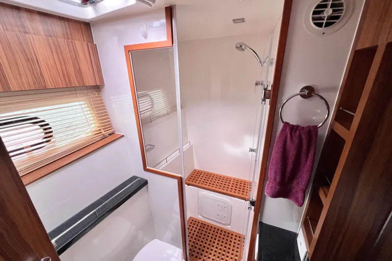 Slide: The Image of Bathroom interior of 2019 Aquila 44 yacht with wooden accents and modern fixtures. - 81