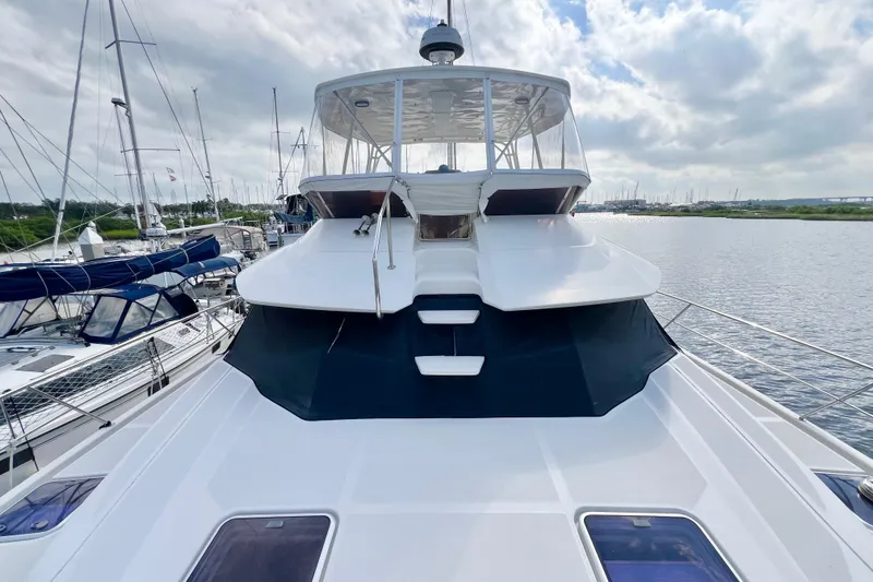 Slide: The Image of 2019 Aquila 44 yacht docked at marina under cloudy sky. - 9