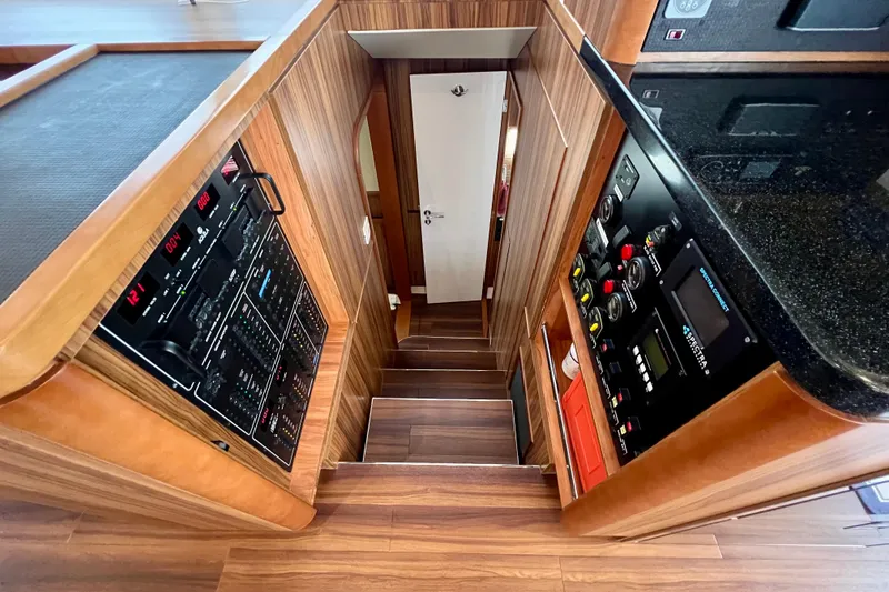 Slide: The Image of Interior of 2019 Aquila 44 yacht with wooden paneling and steps. - 91
