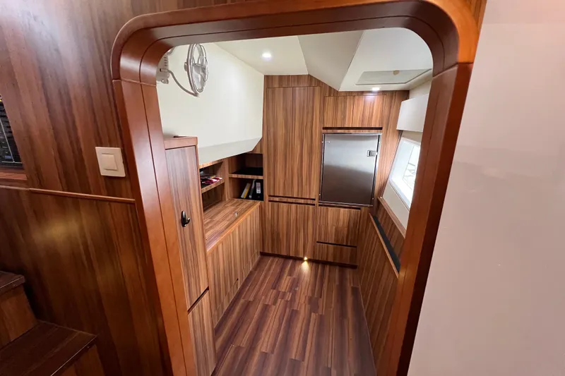 Slide: The Image of Staircase in 2019 Aquila 44 yacht with control panels and wood finish. - 92