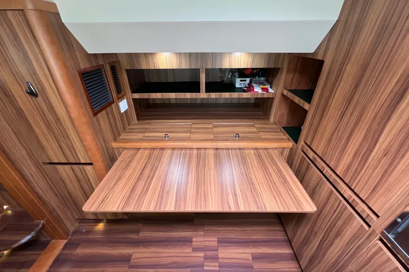 Slide: The Image of Modern wooden interior of 2019 Aquila 44 yacht with sleek cabinetry and stainless steel accents. - 95