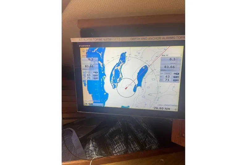 Slide: The Image of Navigation screen on 1980 Alden 44 sailboat, displaying nautical chart and data. - 12