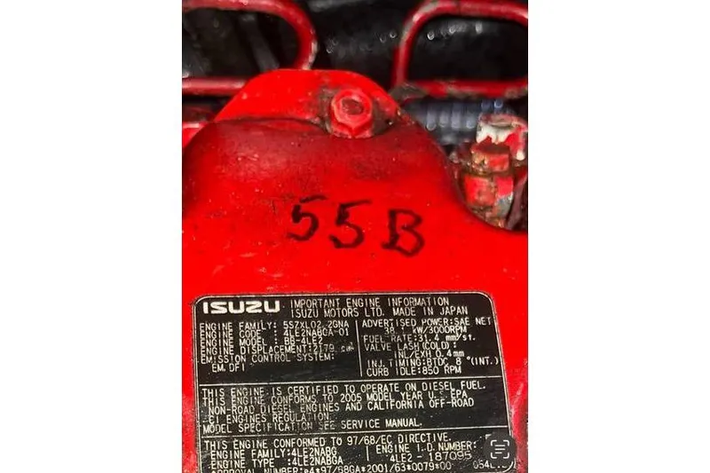 Slide: The Image of Red Isuzu engine with specifications label, Alden model 44, year 1980. - 18