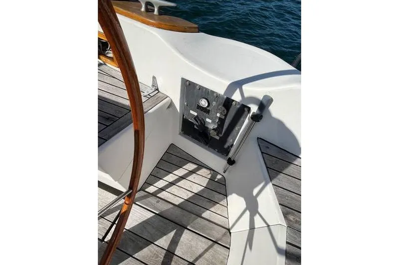 Slide: The Image of Cockpit of 1980 Alden 44 sailboat with wooden wheel and control panel. - 22