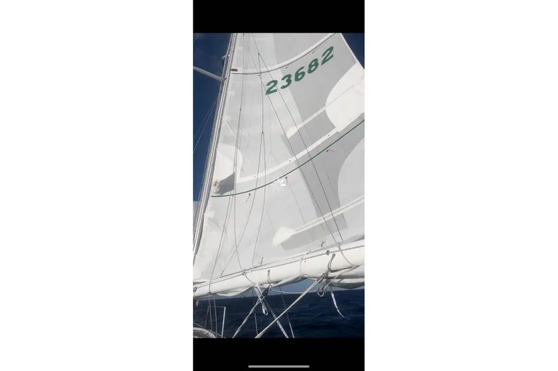 Slide: The Image of Sailboat with white sails and number 23682, Alden 44 model, 1980. - 24