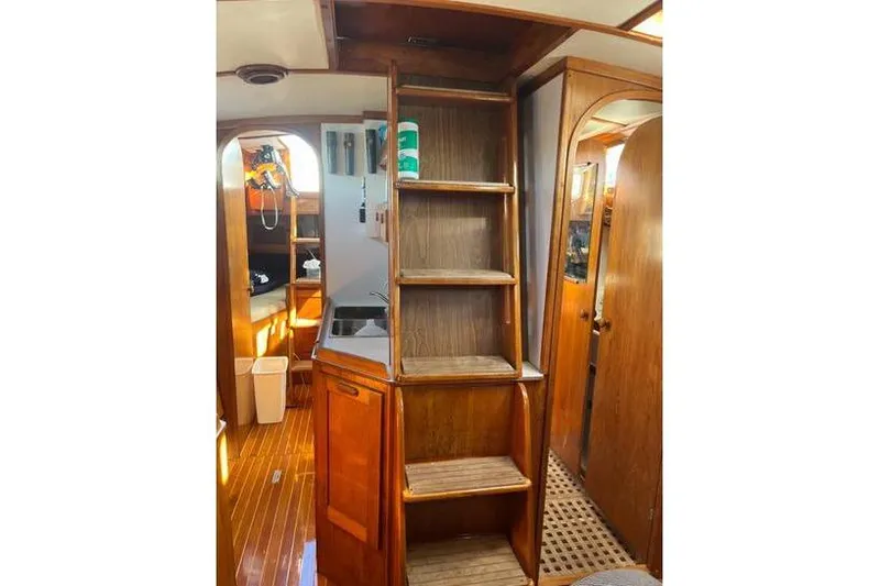 Slide: The Image of Interior of 1980 Alden 44 sailboat with wooden stairs and cabinetry. - 5