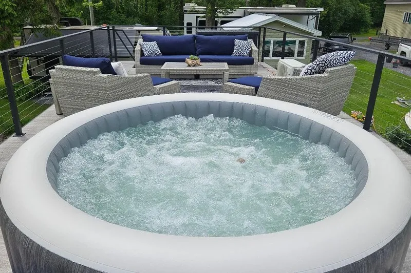 Slide: The Image of Outdoor hot tub on East Coast Houseboats Freedom 40, 2021 model, with patio seating. - 19