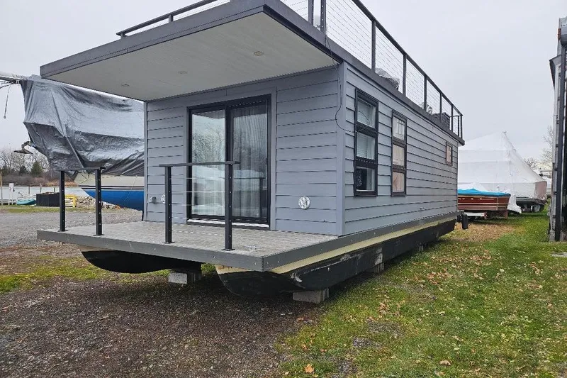 Slide: The Image of Modern 2021 East Coast Houseboats Freedom 40 with sleek design and spacious deck. - 20