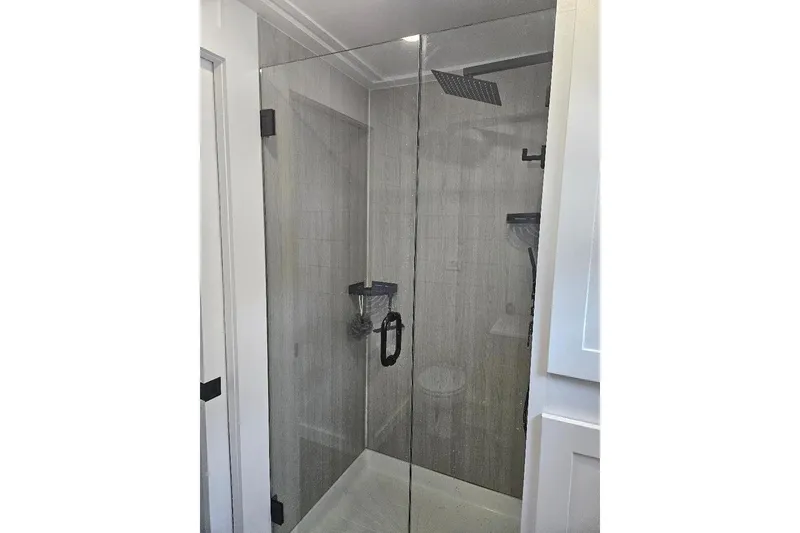 Slide: The Image of Modern glass shower in 2021 East Coast Houseboats Freedom 40 model. - 9