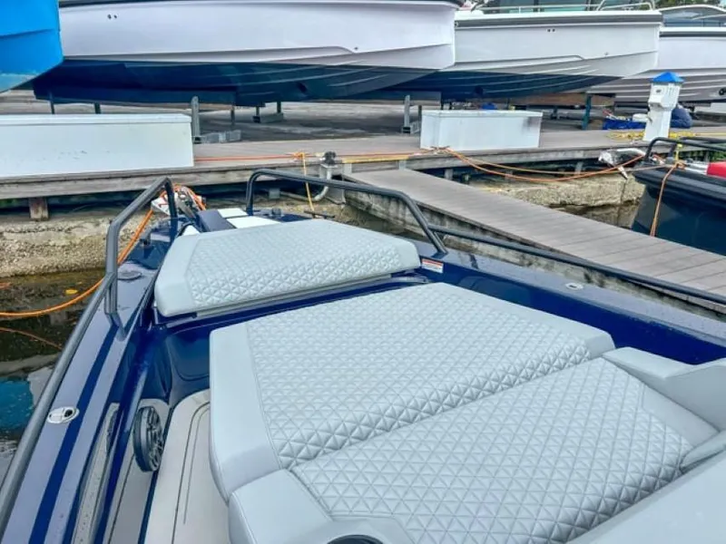 Slide: The Image of 2024 BRABUS Shadow 1000 ST luxury boat docked with cushioned seating. - 25