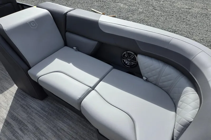 Slide: The Image of 2026 Godfrey Sweetwater 2086 C boat interior with luxurious gray seating and speaker. - 11