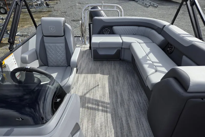 Slide: The Image of 2026 Godfrey Sweetwater 2086 C pontoon boat interior with plush seating and modern design. - 12