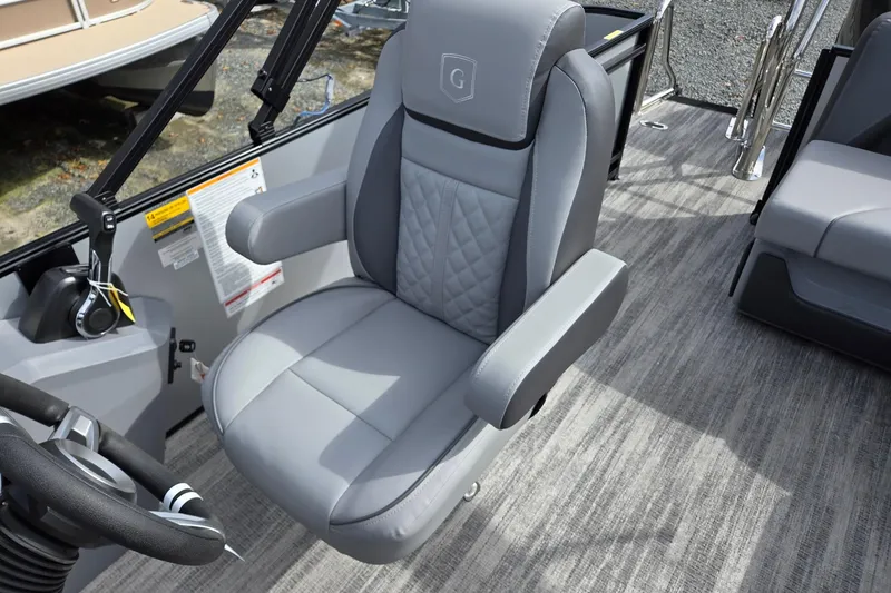 Slide: The Image of Captain's chair on 2026 Godfrey Sweetwater 2086 C pontoon boat, featuring sleek design. - 14