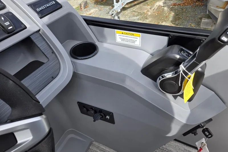 Slide: The Image of Interior of 2026 Godfrey Sweetwater 2086 C boat, featuring control panel and cup holder. - 19