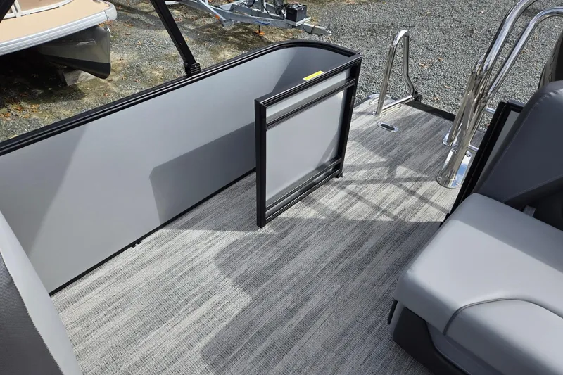 Slide: The Image of 2026 Godfrey Sweetwater 2086 C boat interior with gray seating and flooring. - 21