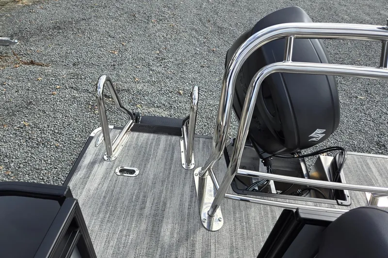 Slide: The Image of 2026 Godfrey Sweetwater 2086 C boat deck with stainless steel railings and motor. - 25