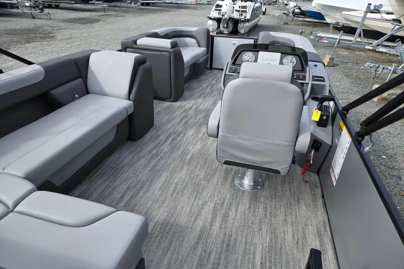 Slide: The Image of 2026 Godfrey Sweetwater 2086 C pontoon boat interior with gray seating and modern dashboard. - 28