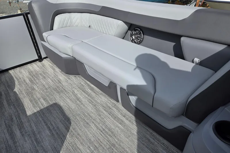 Slide: The Image of 2026 Godfrey Sweetwater 2086 C boat interior with gray cushioned seating and speaker. - 34