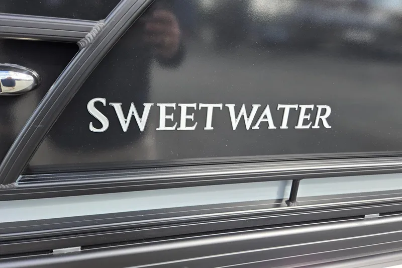 Slide: The Image of 2026 Godfrey Sweetwater 2086 C boat logo on black surface. - 36