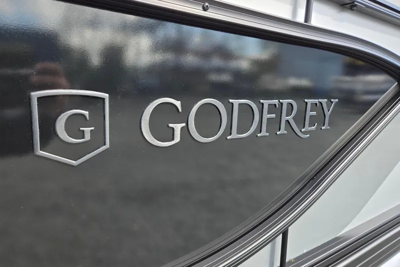 Slide: The Image of Close-up of 2026 Godfrey Sweetwater 2086 C logo on a sleek black surface. - 37