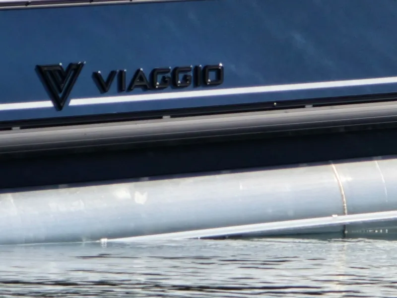 Slide: The Image of Viaggio V20C pontoon boat 2026 docked on a sunny day. - 22
