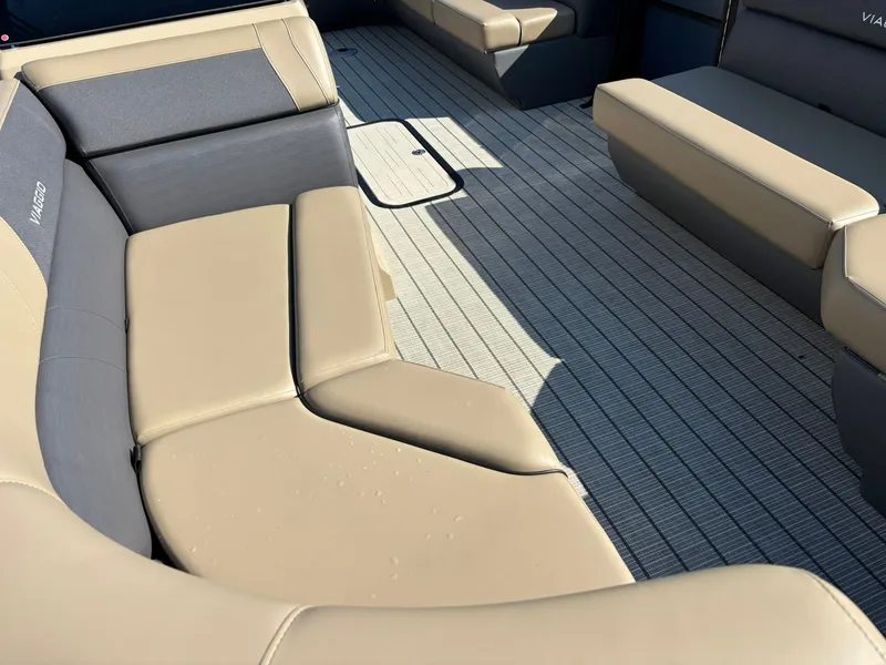 Slide: The Image of Viaggio V20C pontoon boat 2026 in water with Suzuki engine. - 28