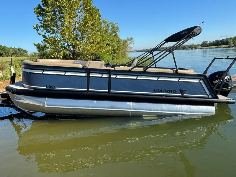 Slide: The Image of Viaggio V20C 2026 pontoon boat on calm lake under sunny skies. - 5