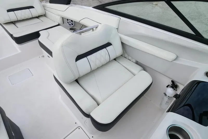 Slide: The Image of Luxurious white seating in 2022 Regal LX2 boat interior. - 13