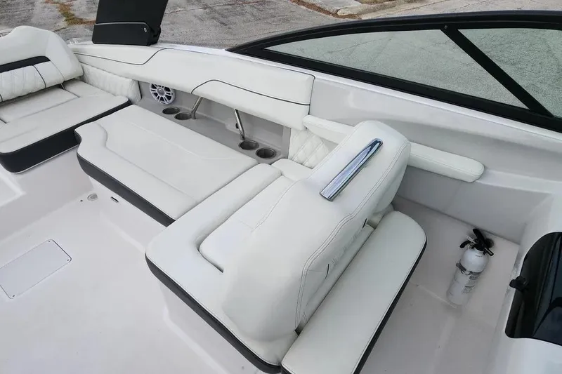 Slide: The Image of Luxurious interior of 2022 Regal LX2 boat with white seating and modern design. - 17