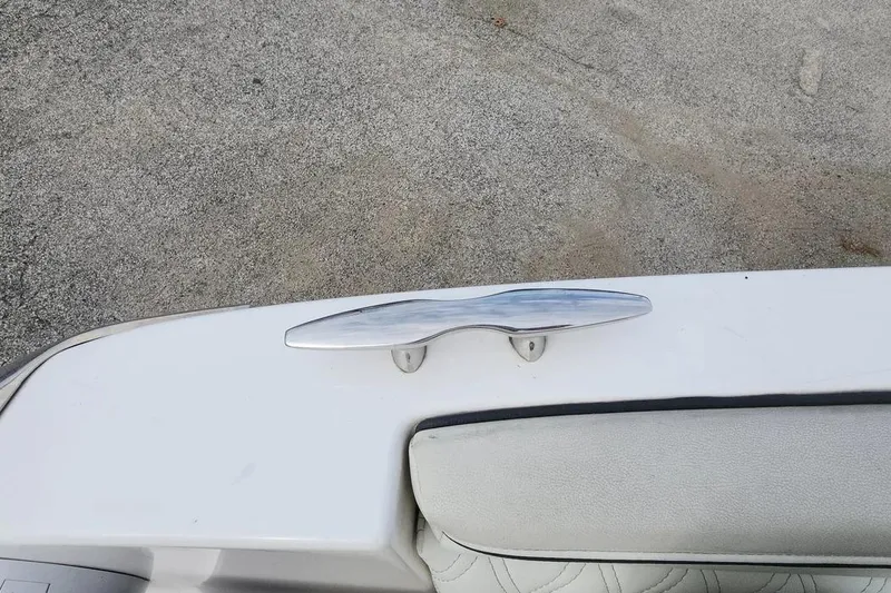 Slide: The Image of 2022 Regal LX2 boat cleat on white deck, close-up view. - 27
