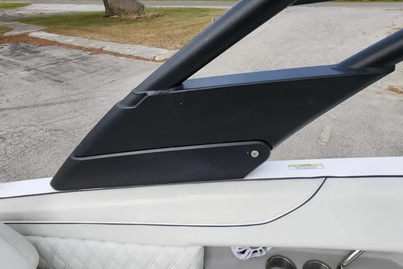 Slide: The Image of 2022 Regal LX2 boat detail, featuring sleek black and white design elements. - 33