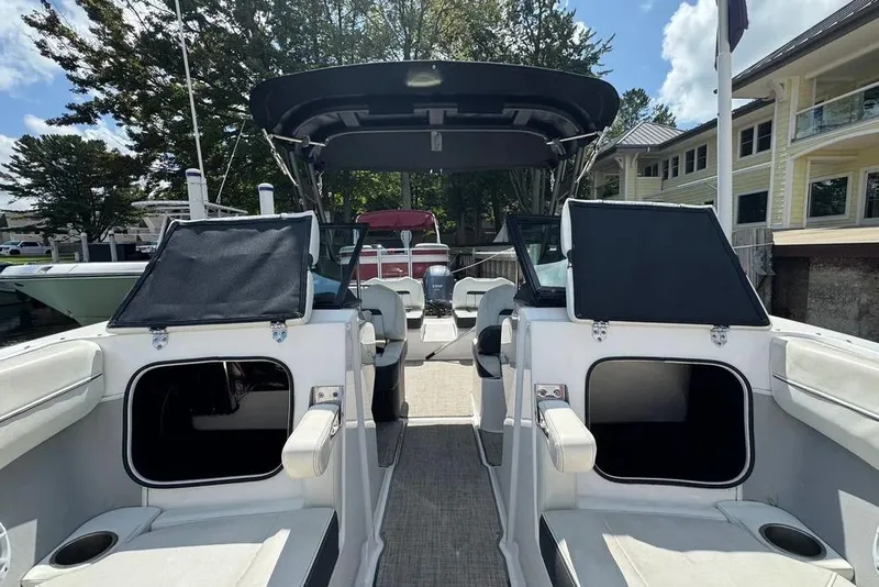 Slide: The Image of 2022 Regal LX2 boat interior with open storage compartments and seating. - 43