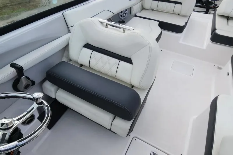 Slide: The Image of 2022 Regal LX2 boat interior with luxurious white and black seating. - 6